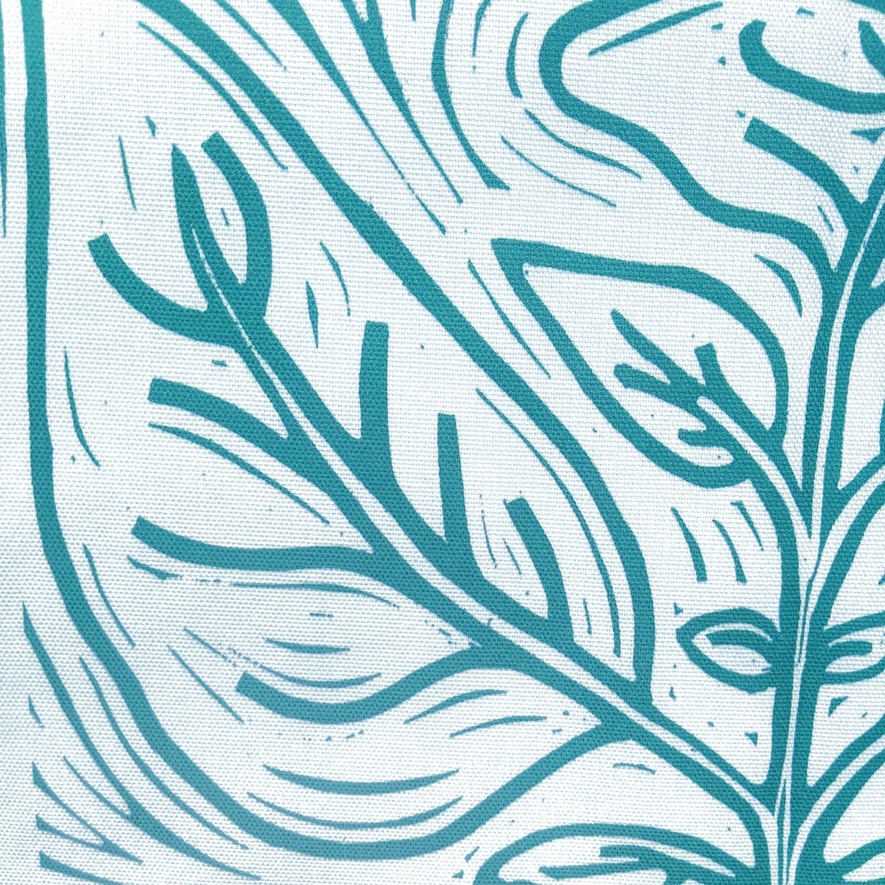 green leaf design on a tea towel