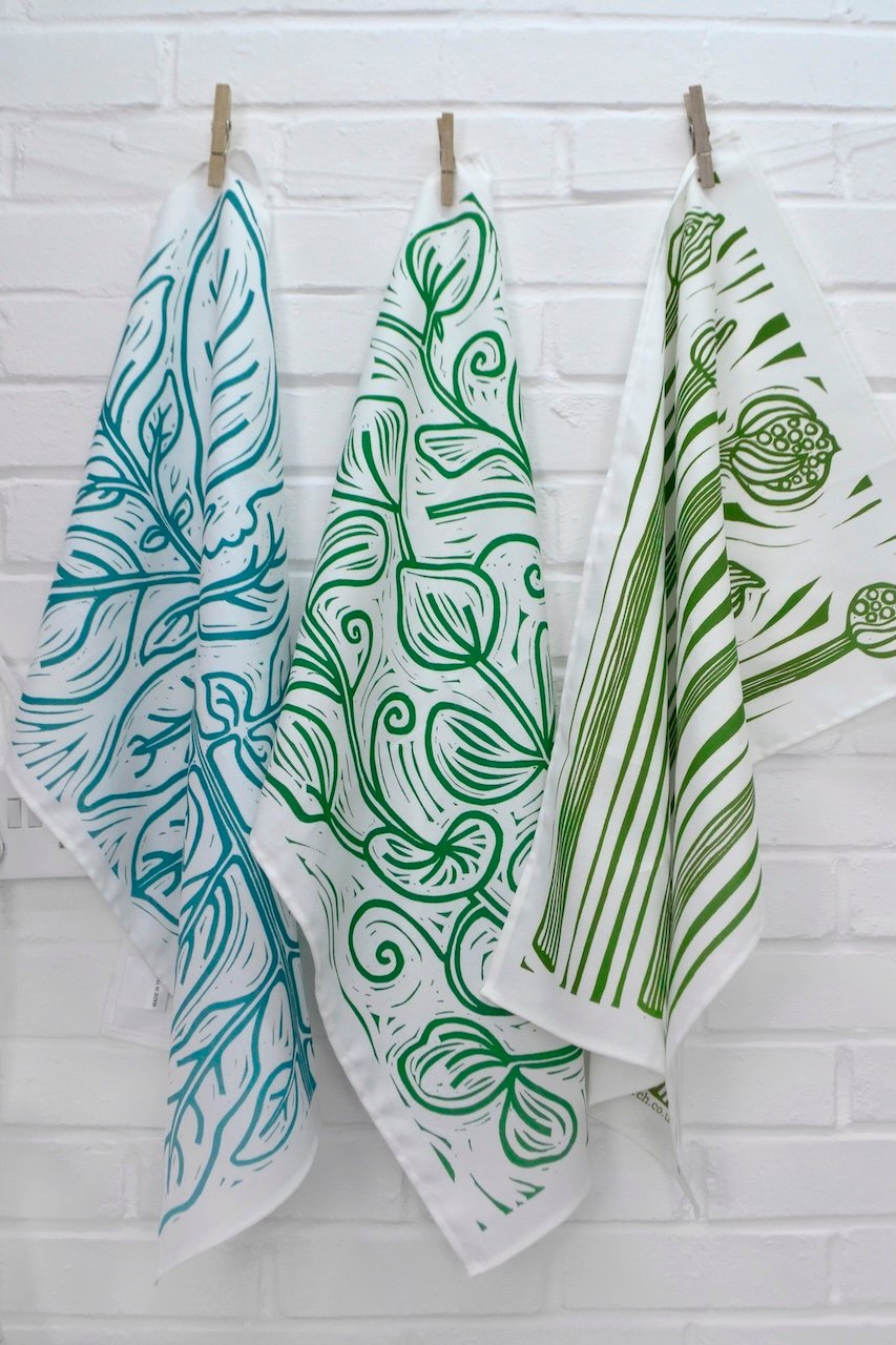 three tea towles designed by Melissa Birch lino print artist